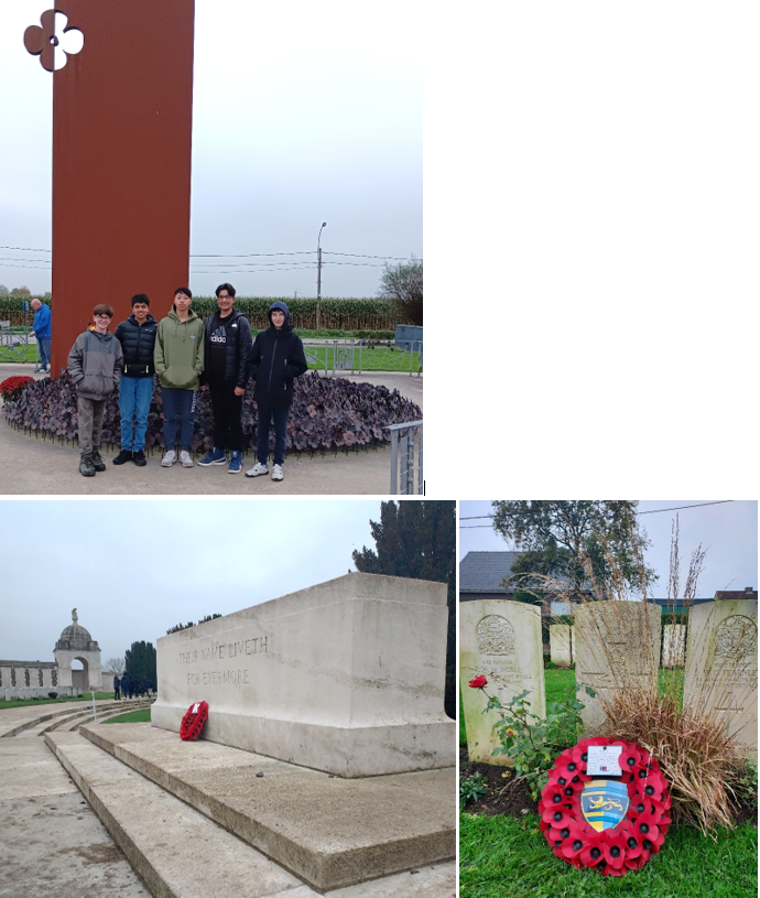 A group of people standing in front of a monument

Description automatically generated