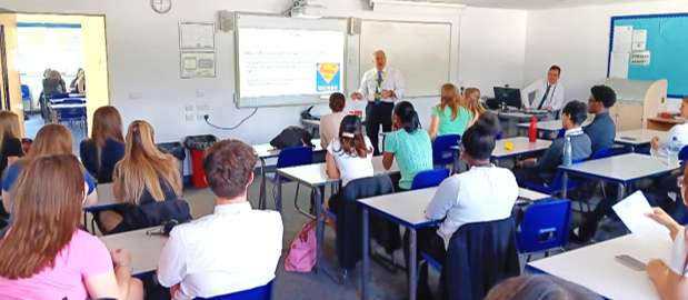 A person standing in front of a classroom

AI-generated content may be incorrect.