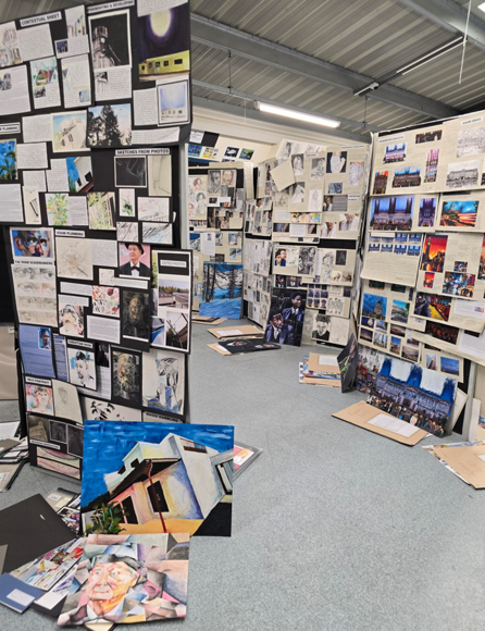 A room with pictures and papers

AI-generated content may be incorrect.