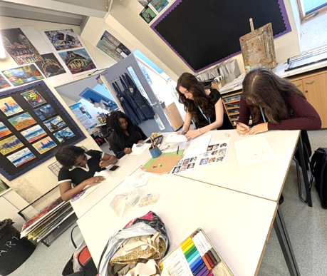 A group of girls sitting at a table

AI-generated content may be incorrect.