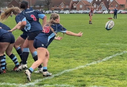 A group of people playing rugby

AI-generated content may be incorrect.