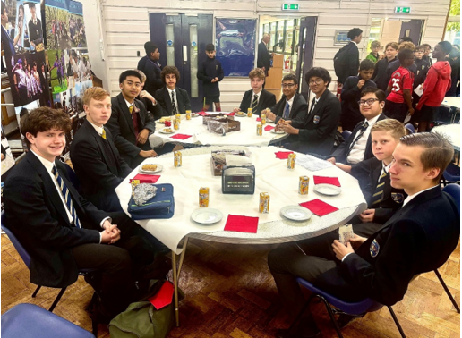 A group of people sitting around a table

AI-generated content may be incorrect.