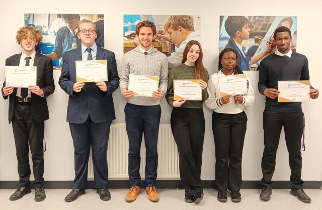 A group of people holding certificates

AI-generated content may be incorrect.