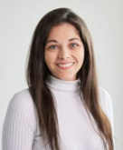 A person with long hair wearing a white turtleneck

AI-generated content may be incorrect.